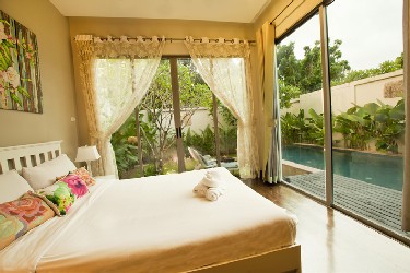 Second Bedroom with View to the Garden, Terrace and the Pool